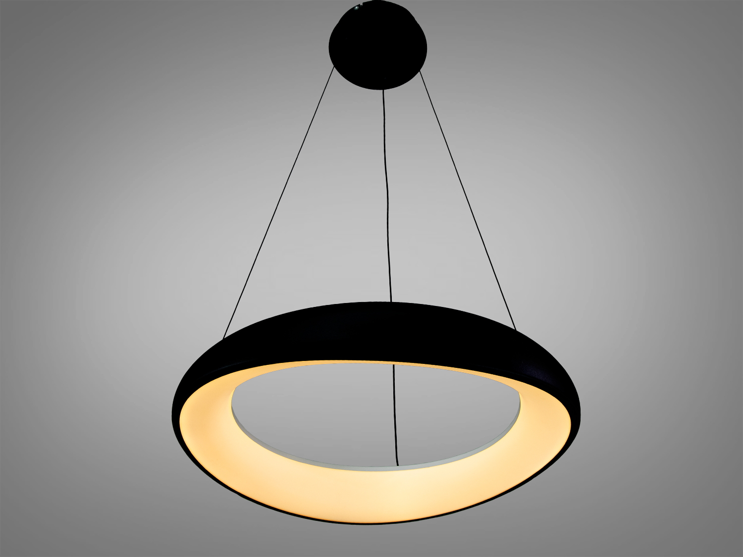 Підвісний світильник з теплим жовтим світлом, круглий корпус, чорний зовні. Підходить для затишних просторів.