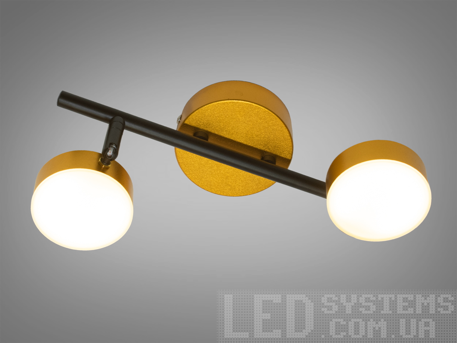 Настінний світильник із двома круглими плафонами, золотистий колір, чорний кронштейн, підходить для сучасного інтер′єру.