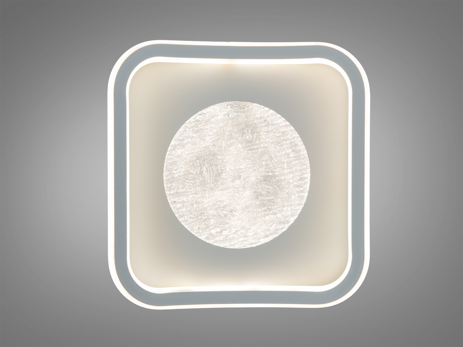 Світильник з округлими кутами та центральним елементом, що нагадує заморожене скло. Ідеальний для сучасного інтер′єру.