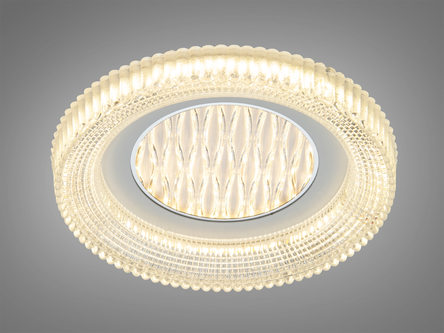 Світильник з теплим жовтим світлом, має круглу форму та декоративний квітковий візерунок, ідеальний для затишних приміщень.