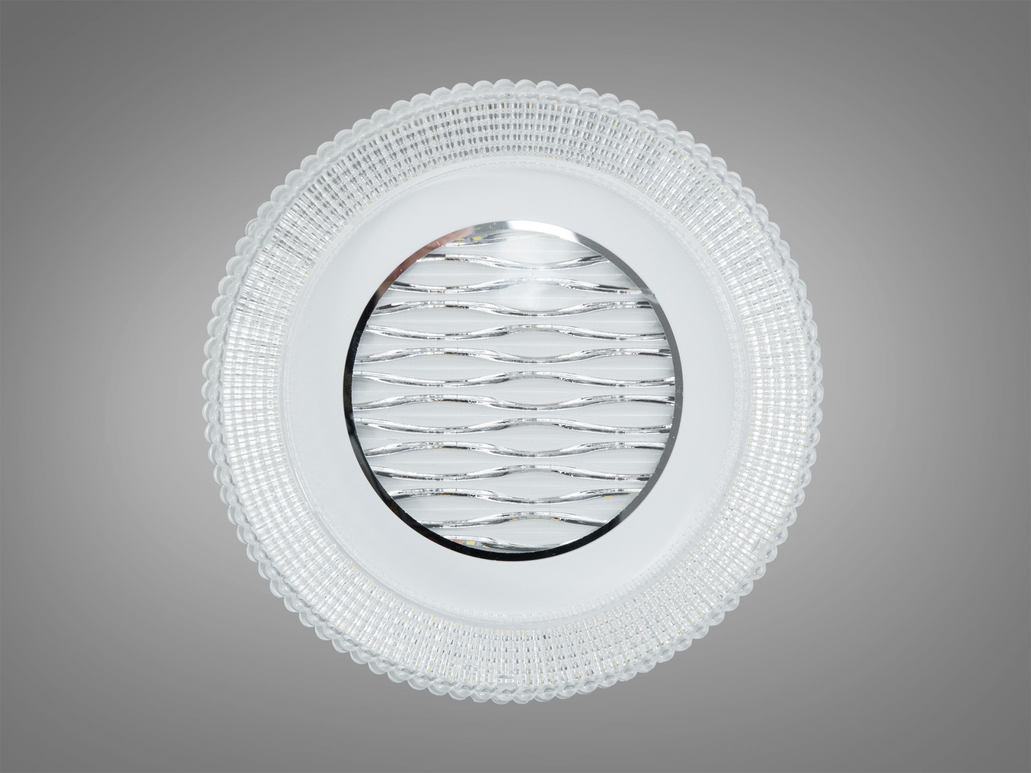 Вбудований світильник з прозорого матеріалу, що випромінює нейтральне світло, з квітковим орнаментом, підходить для стельового монтажу.