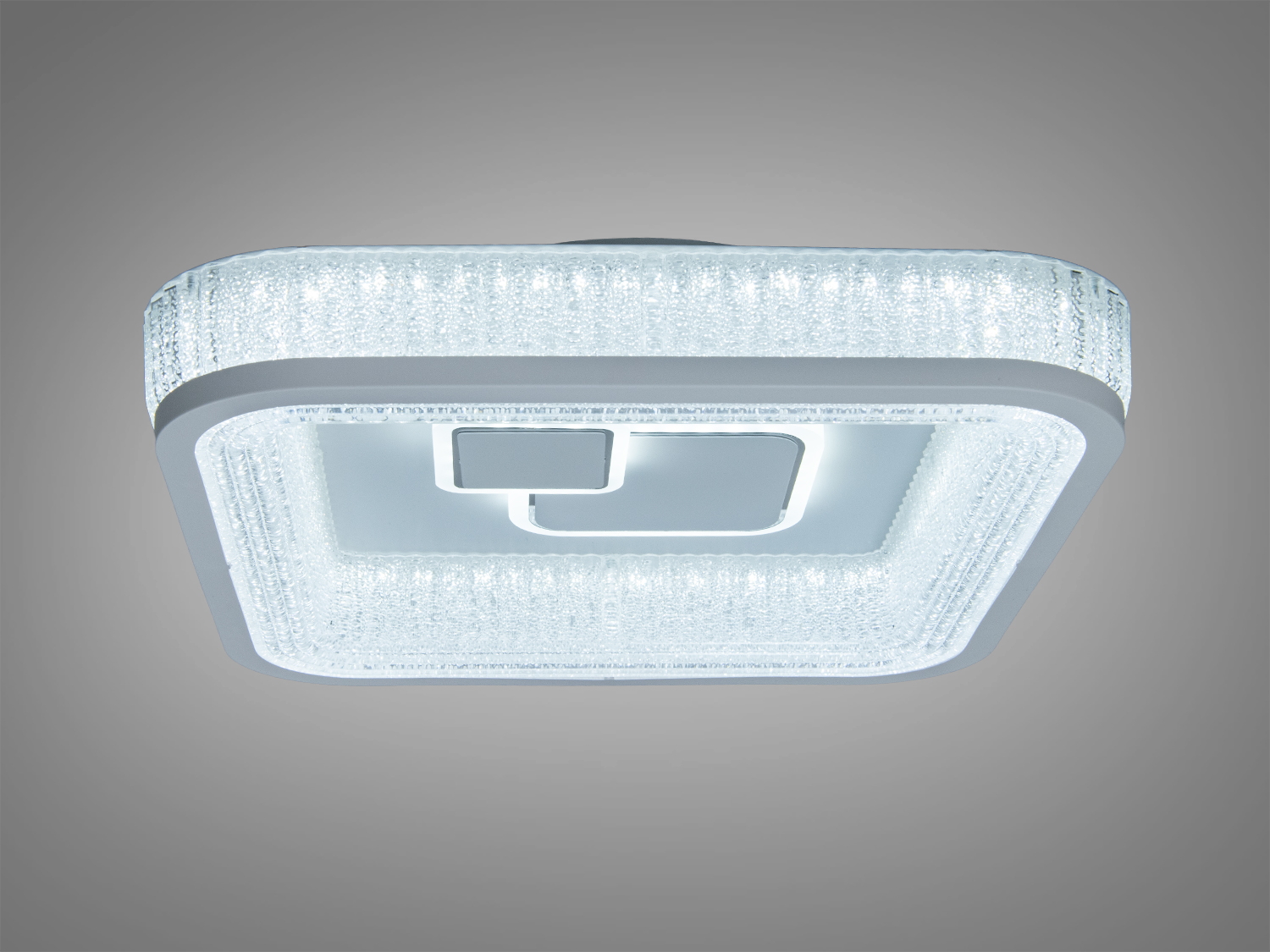 Вбудований світильник з прозорого матеріалу, що випромінює нейтральне світло, з квітковим орнаментом, підходить для стельового монтажу.