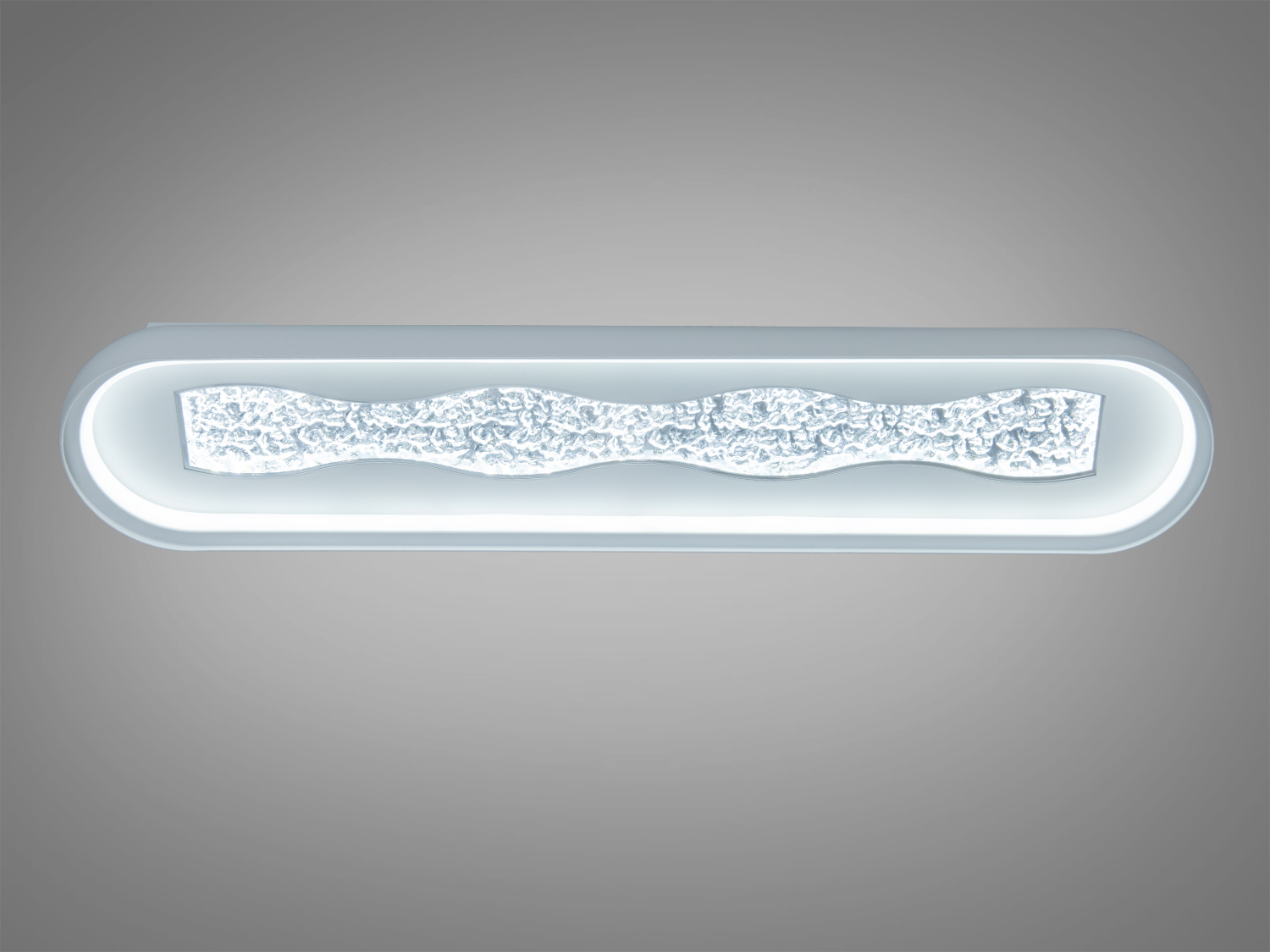 Довгий світильник з хвилястим акриловим візерунком, призначений для сучасного інтер′єру. Виконаний у холодному білому кольорі, забезпечує яскраве освітлення.