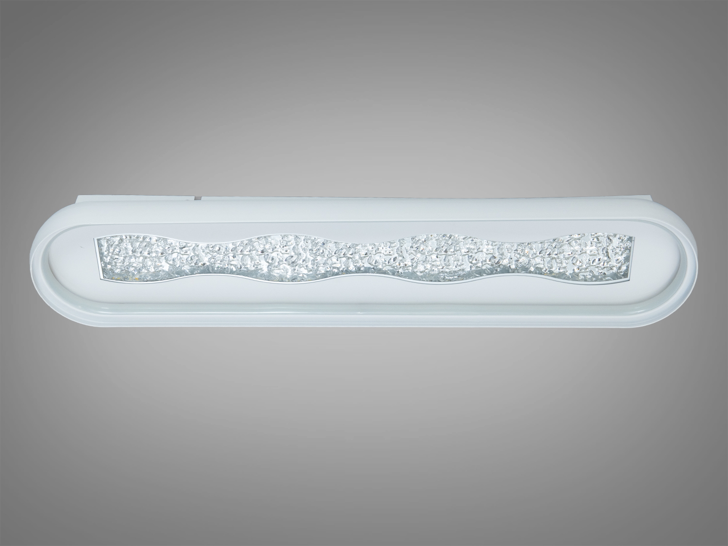 Настінний світильник з текстурованою акриловою поверхнею, має хвилястий центральний елемент. Підходить для ванних кімнат, забезпечує рівномірне світло.