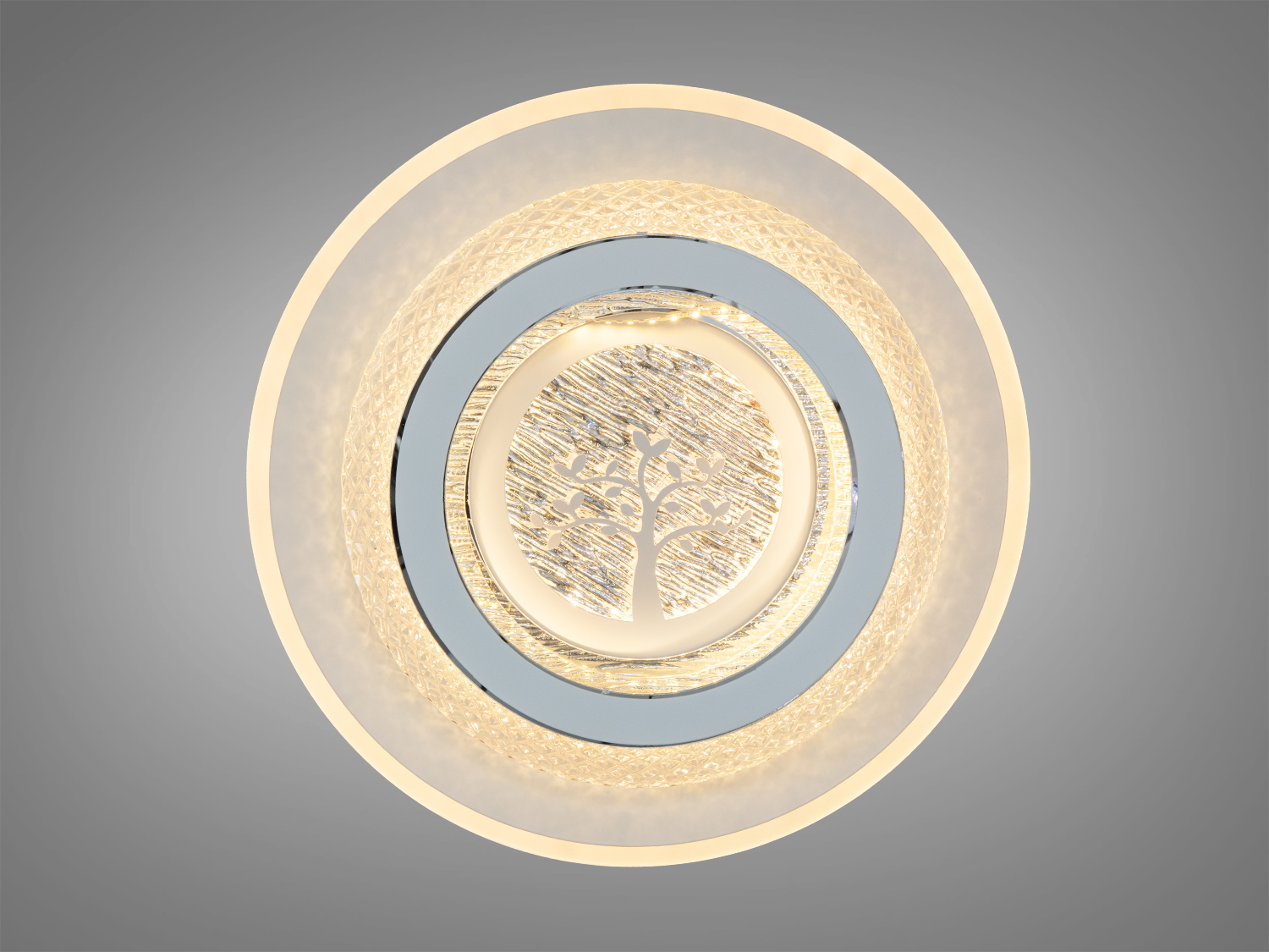 Світильник з теплим жовтим світлом, має круглу форму та декоративний квітковий візерунок, ідеальний для затишних приміщень.