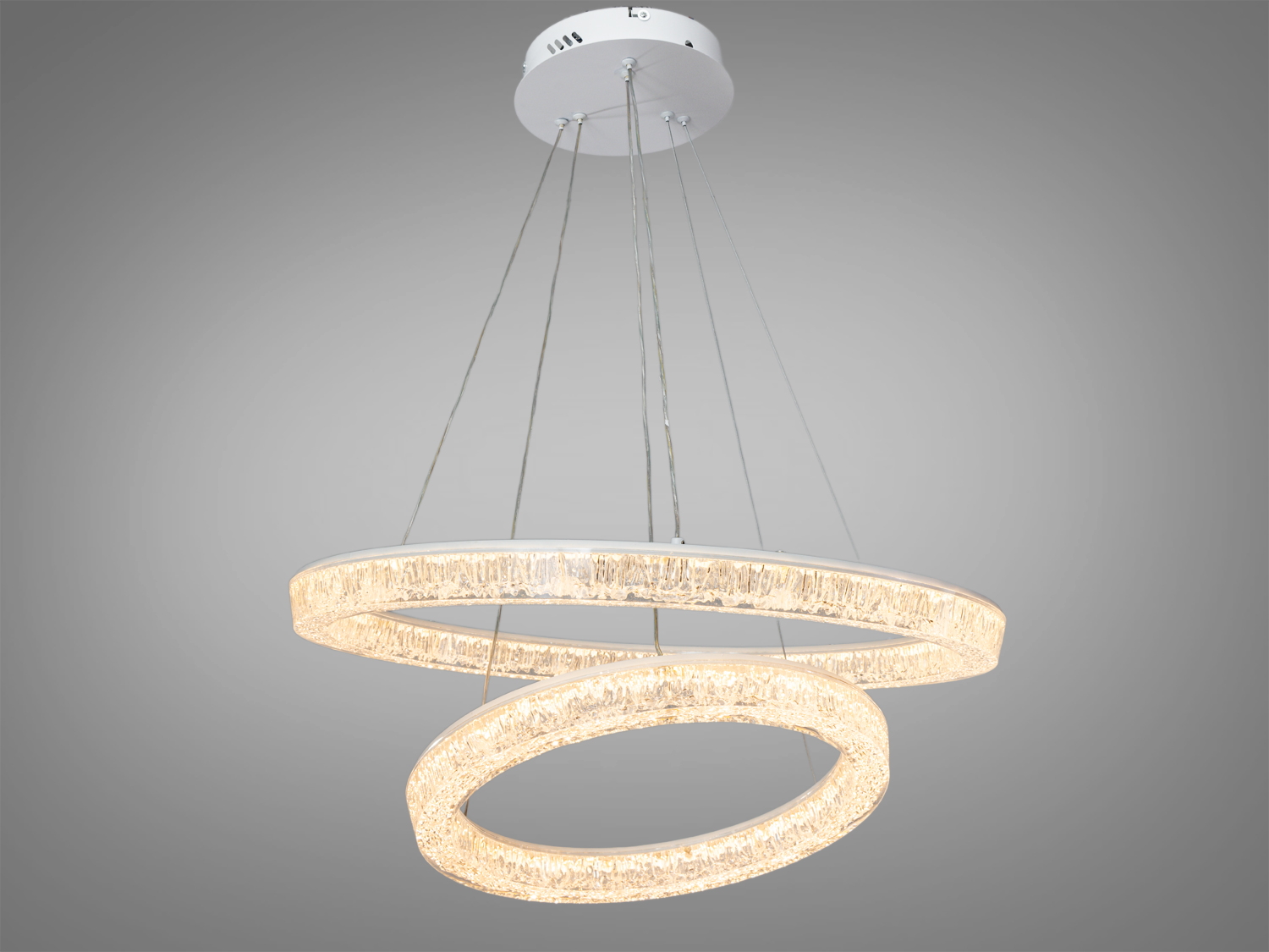 Підвісний світильник з двома акриловими кільцями, що випромінюють тепле світло. Підходить для затишних інтер′єрів.