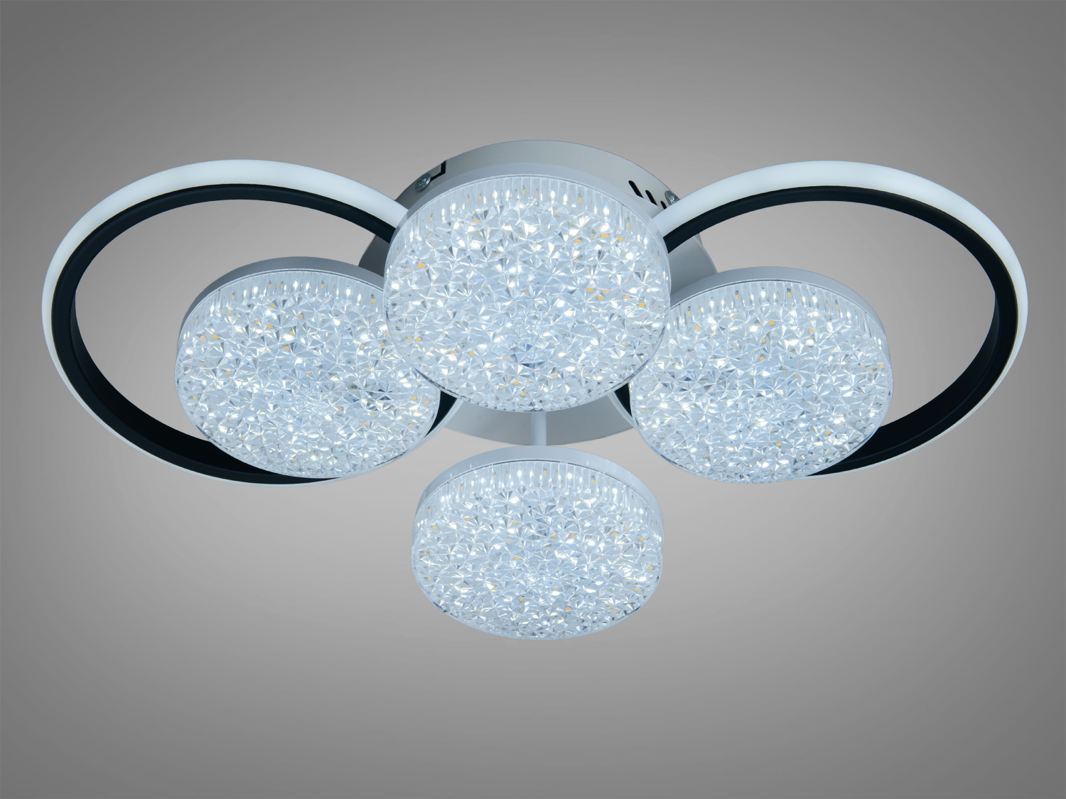 Стельовий світильник з чотирма круглими LED елементами, що випромінюють холодне біле світло. Ідеально підходить для офісних приміщень.