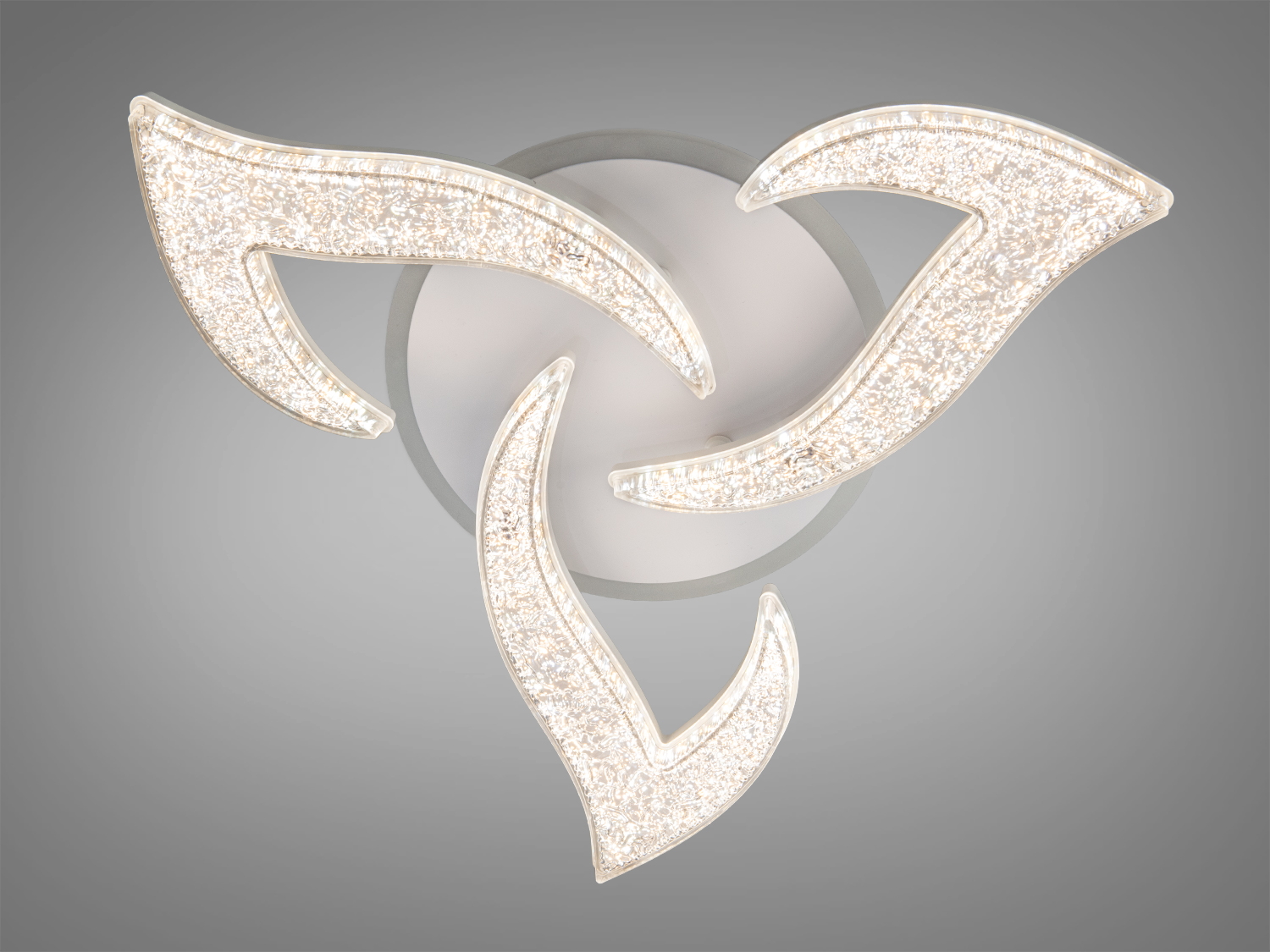 Стельовий світильник із трьома акриловими LED-елементами, що нагадують пелюстки. Прозорий матеріал додає легкості.