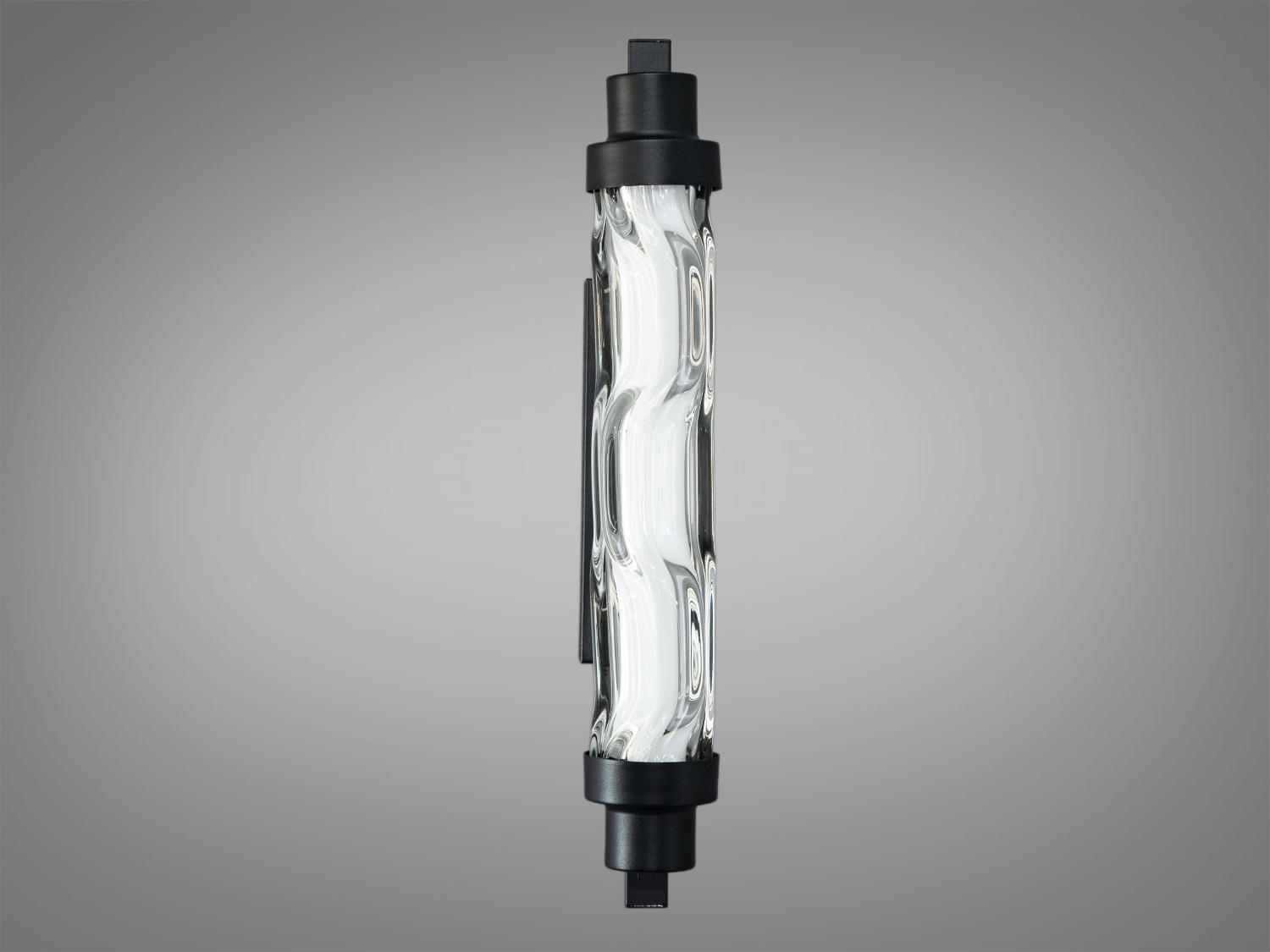 Циліндричний настінний світильник з прозорим хвилястим склом, чорні металеві деталі. Ідеальний для освітлення коридорів.