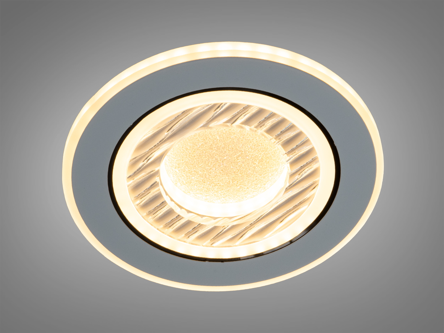 Круглий світильник з жовтим світлом, підходить для вбудованого монтажу. Використовується для створення затишної атмосфери.