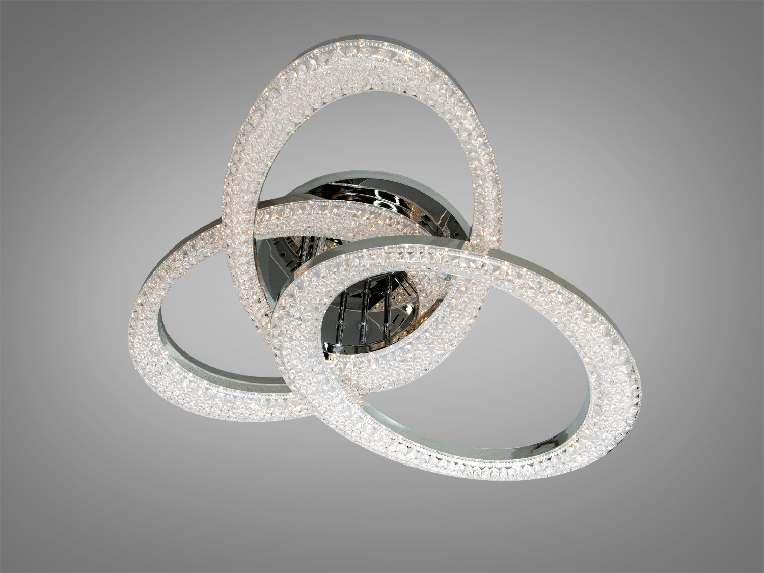 Лампа з чотирма шестикутними елементами, виконана з прозорого матеріалу, підходить для офісного простору.