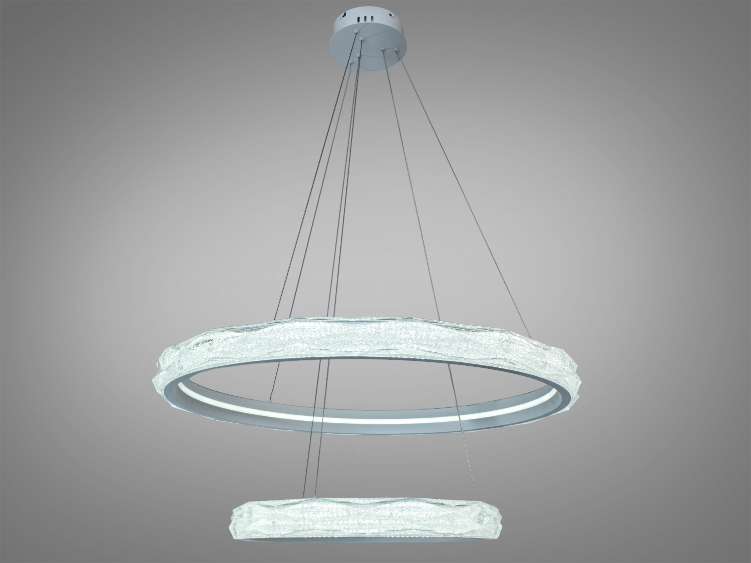 Підвісний світильник з двома кільцями, виготовлений з прозорого матеріалу, підходить для високих стель. Регульована висота підвіски.