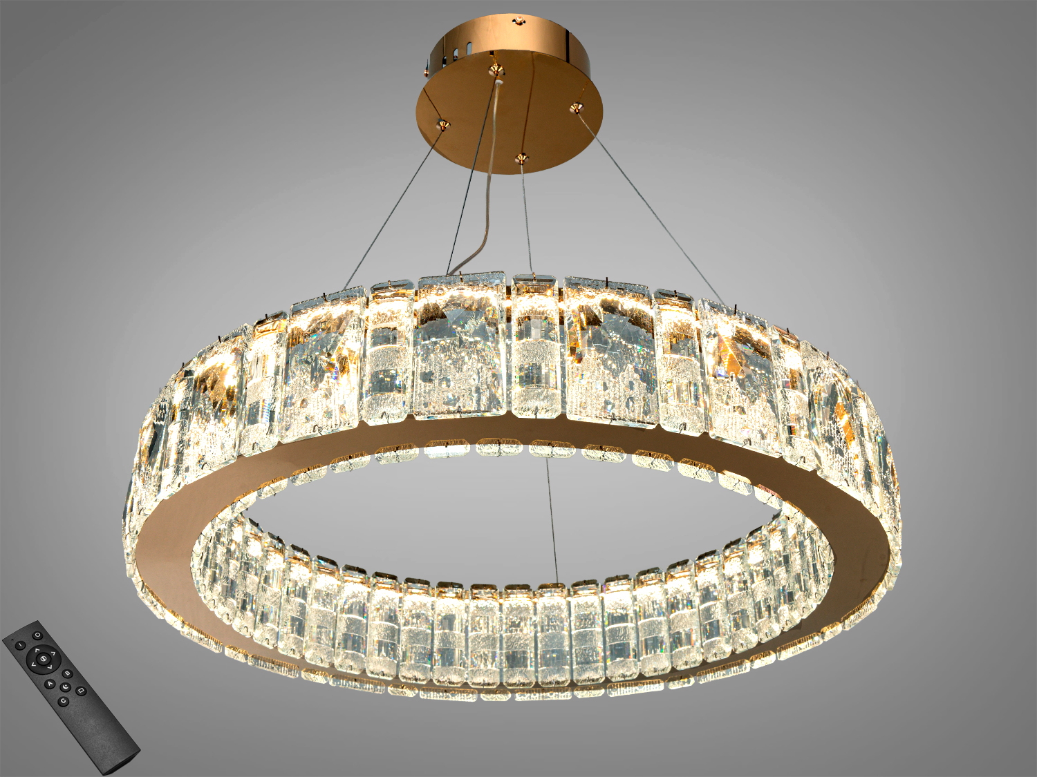 Підвісна люстра круглої форми з кришталевими елементами, що створюють ефект розсіяного світла. Призначена для віталень.