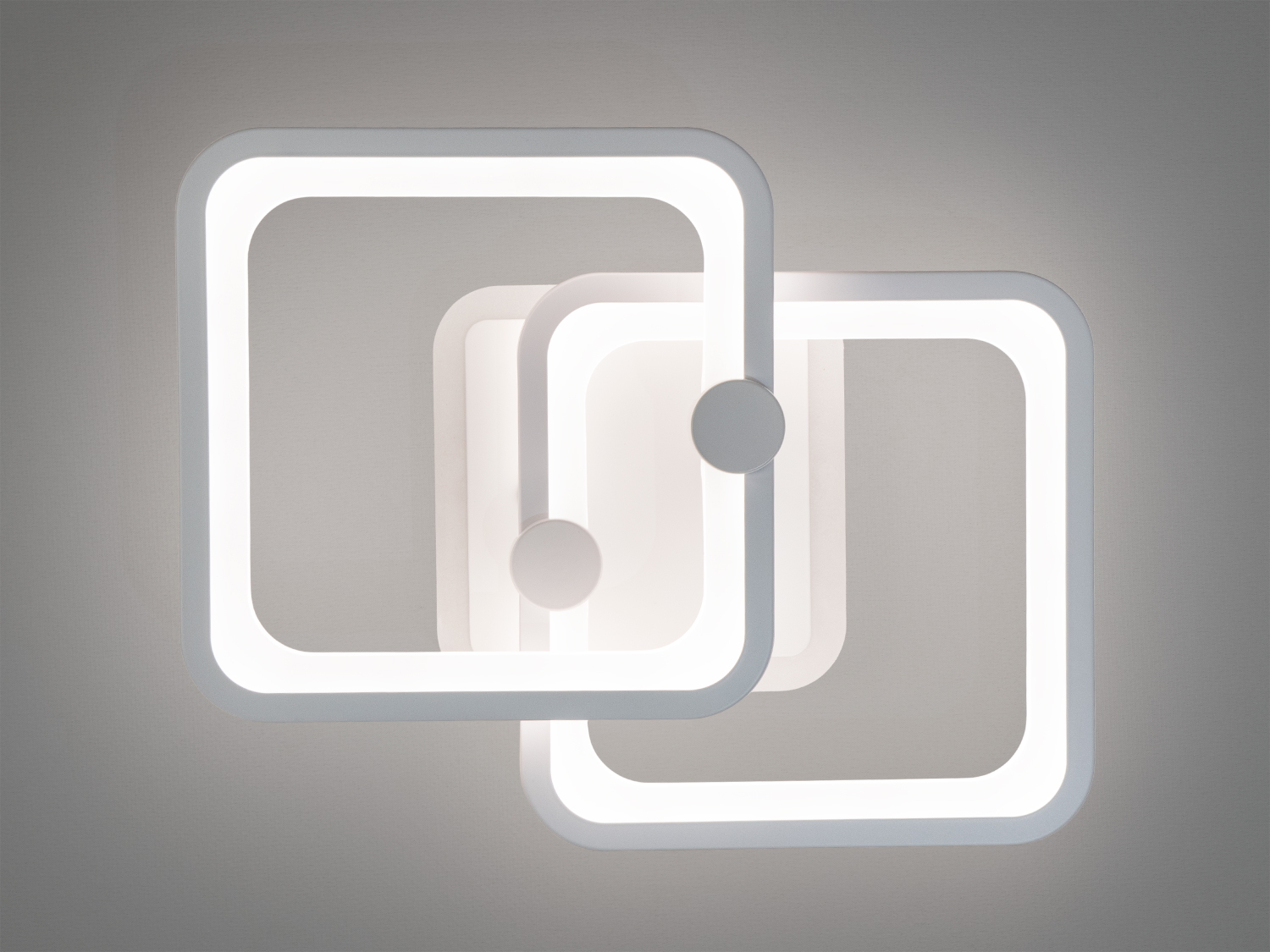 Мінімалістичний світильник з двома квадратними рамками, що випромінюють яскраве біле світло. Підходить для офісних приміщень або робочих зон.