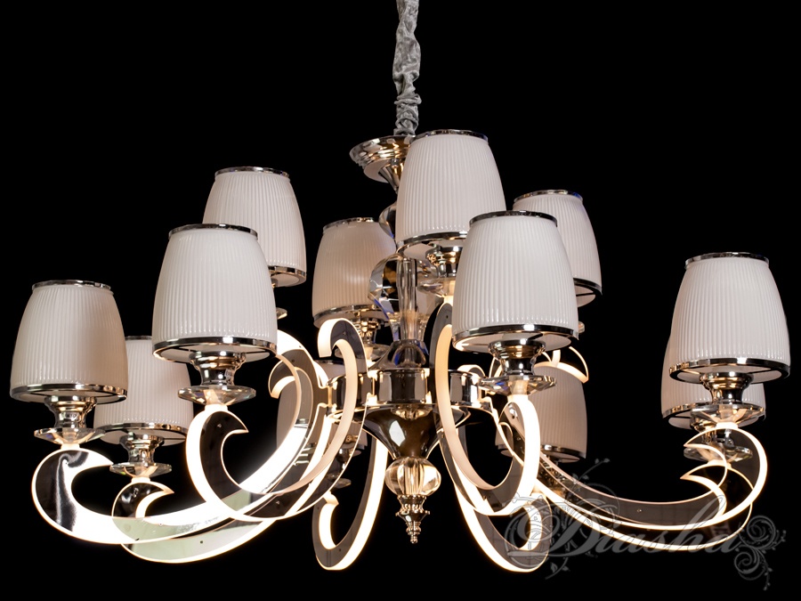 Так - подібної люстрою можна здивувати будь-якого. Така люстра стане яскравою і незабутньою частиною будь-якого інтер'єру - банкетного або концертного залу, вітальні або спальні, ресторану або готелю. Подивіться, як прикрашає її оксамитовий чохол. Втім, Ви самі зможете вирішити, як буде виглядати ця люстра в Вашому інтер'єрі: класично - з простим ланцюгом, або благородно - з ланцюгом в оксамитовому чохлі. І все це доповнене оригінальним підсвічуванням, що виливається з самої її серцевини.
Традиційність, багатство, розкіш, вірність і фундаменталізм втілені в новому дизайні - вічної класики. І ще одна важлива деталь - в цій люстрі можна використовувати будь-який тип ламп на патрон Е14. Це можуть бути і знайомі з дитинства лампи розжарювання, і компактні люмінесцентні лампи 