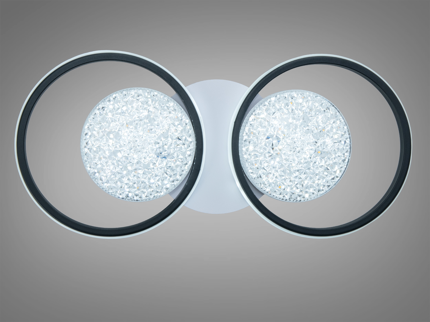 Світильник з двома LED-лампами в чорних кільцях, підходить для стельового монтажу. Ідеальний для освітлення вітальні.