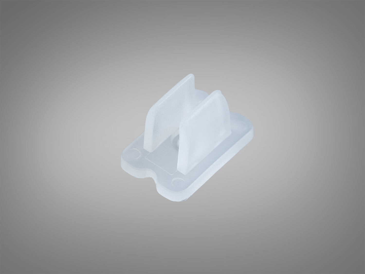 Прозорий пластиковий кріплення для монтажу, має прямокутну основу з двома вертикальними фіксаторами.