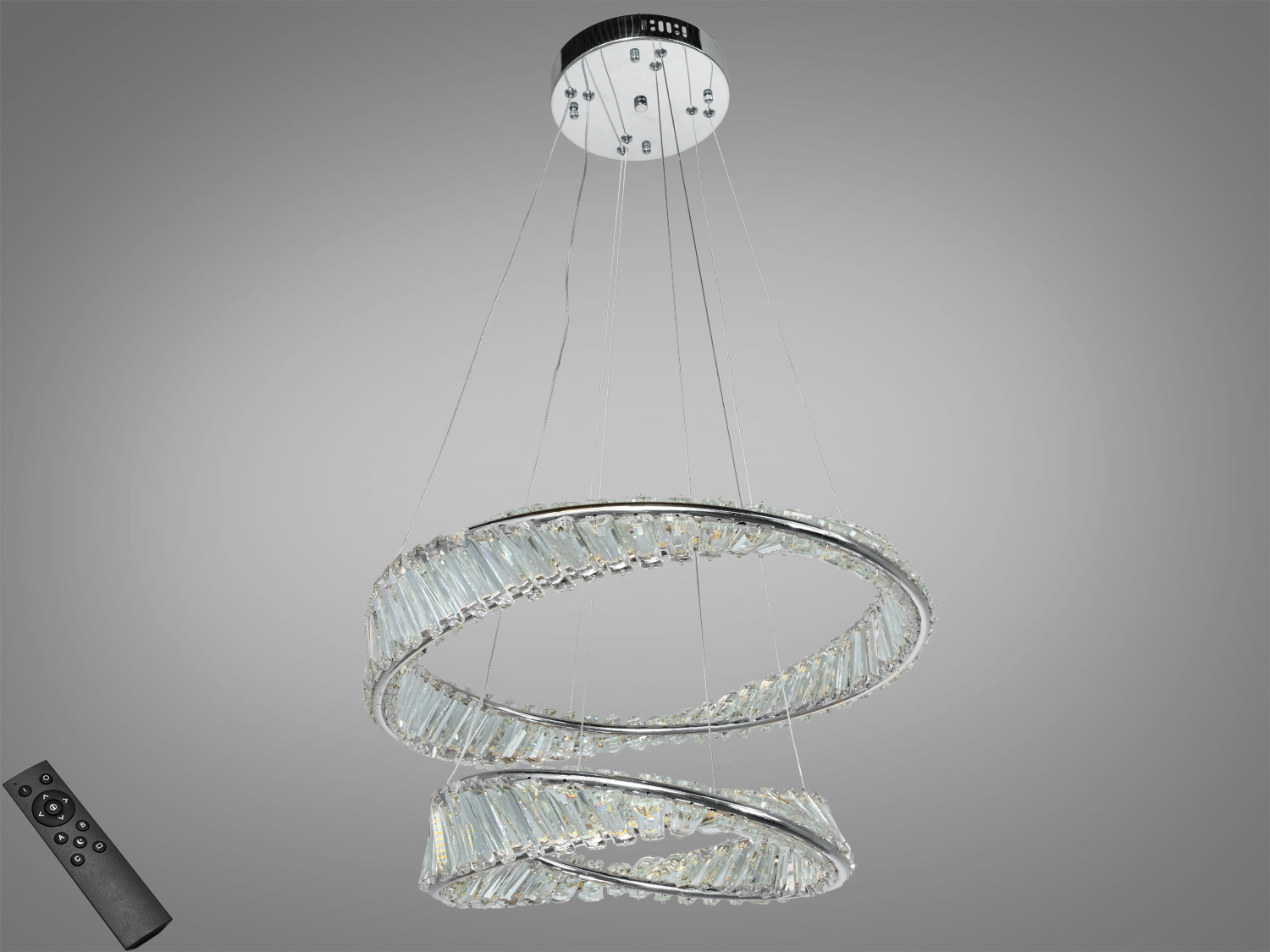 Підвісний світильник з двома кільцями, прикрашеними кришталевими вставками, на тросах. Пульт дистанційного керування для зручного використання.