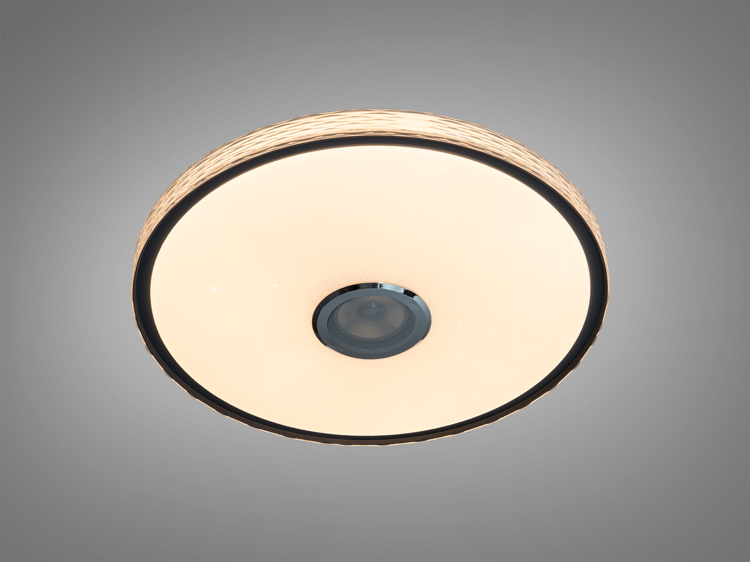 Кругла стельова лампа з теплим жовтим світлом, що підходить для затишних приміщень, з декоративним боковим візерунком.