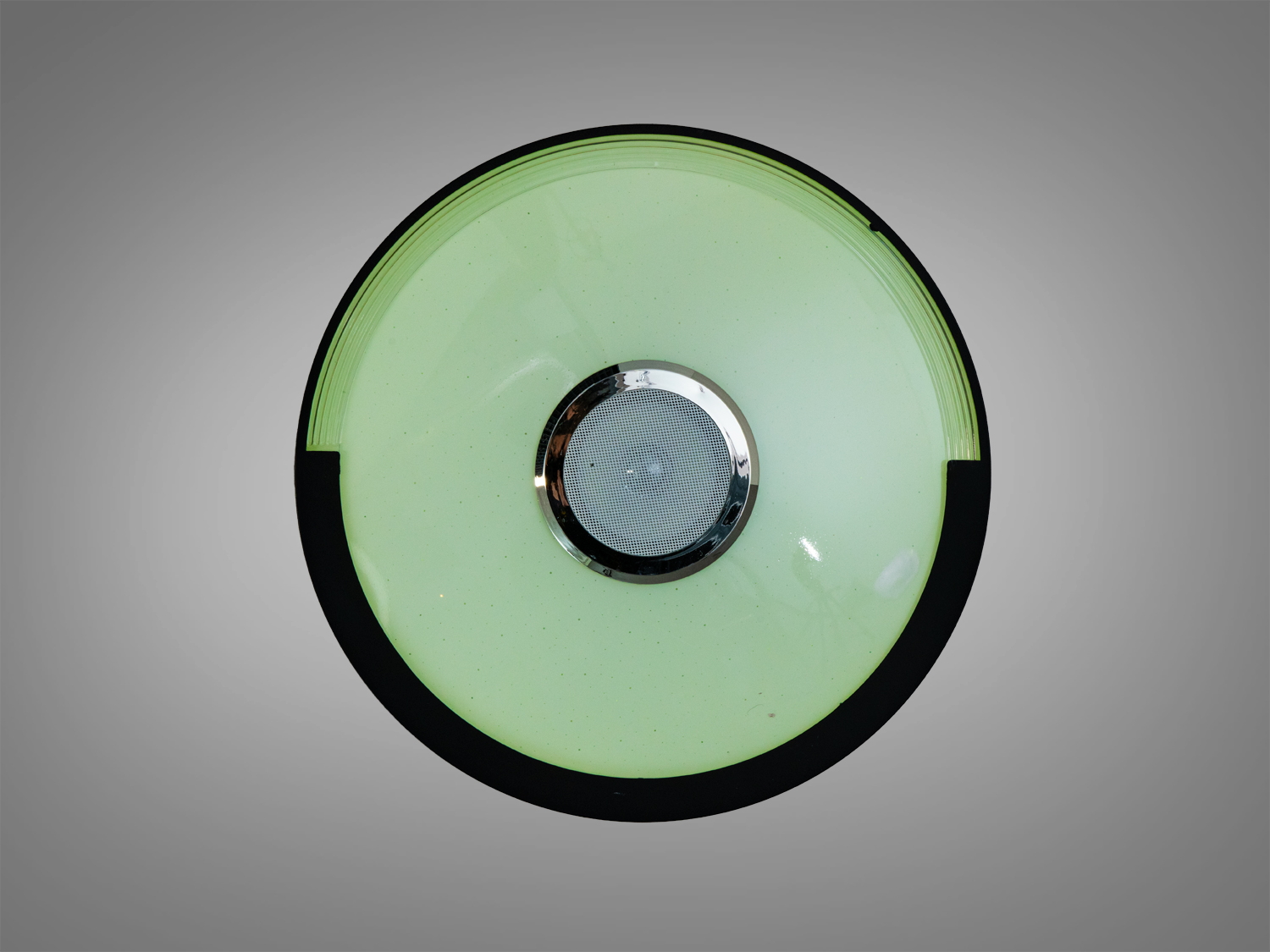 Стельова лампа з зеленим відтінком світла, круглої форми. Ідеальна для створення спокійної атмосфери в кімнаті.