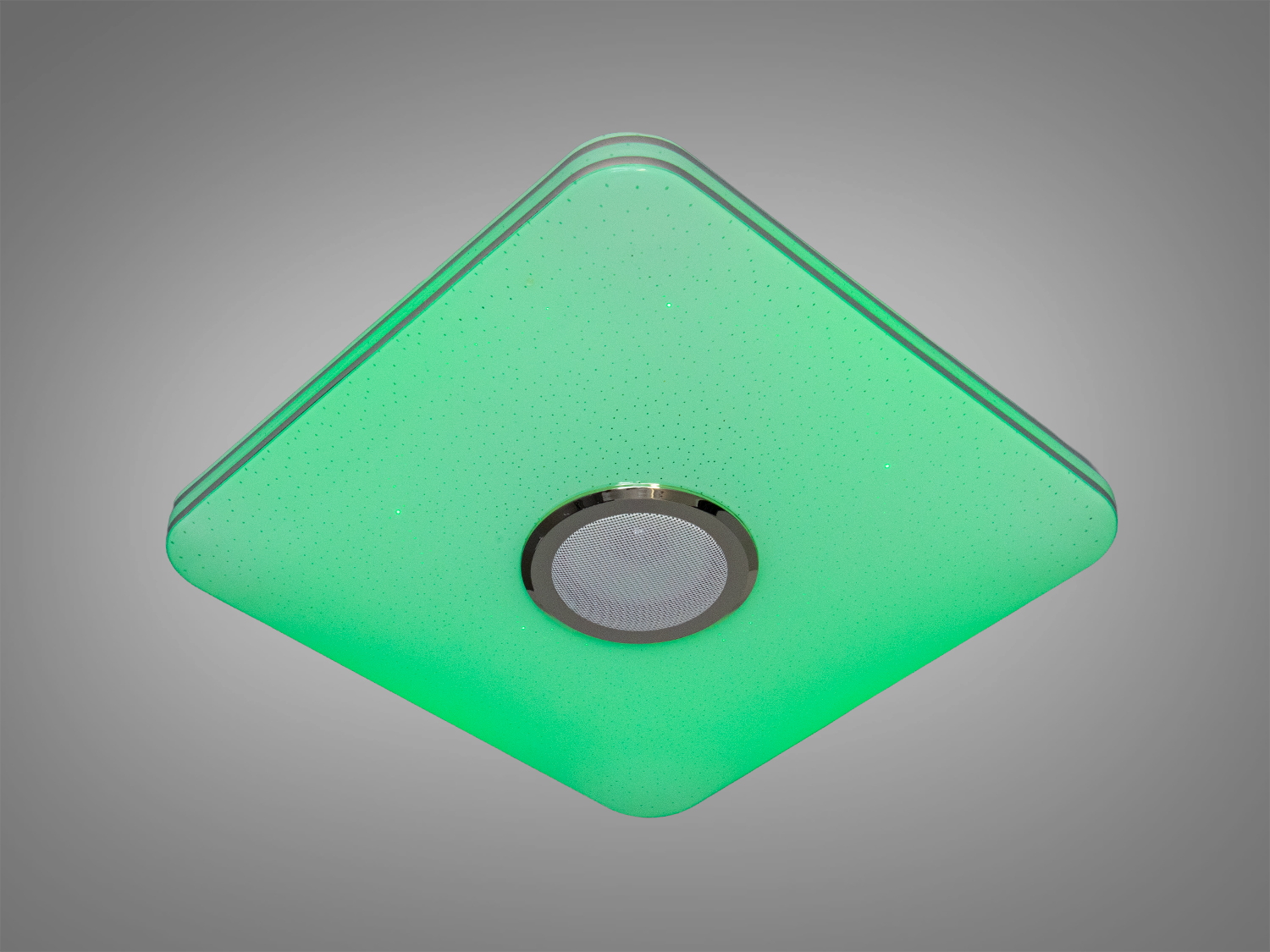 Світильник у формі ромба з пультом, випромінює зелений світло, підходить для монтажу на стелі у вітальні або офісі.