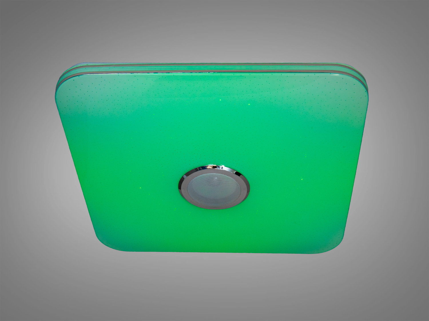 Світильник квадратної форми з зеленим світлом, оснащений центральним динаміком. Підходить для стельового монтажу в сучасних інтер′єрах.