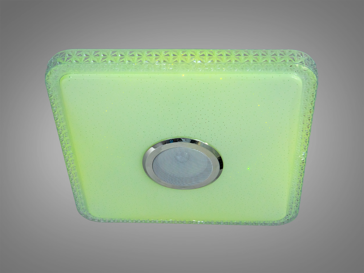 Світильник із зеленим відтінком, квадратної форми, з декоративним краєм. Підходить для освітлення вітальні або спальні.