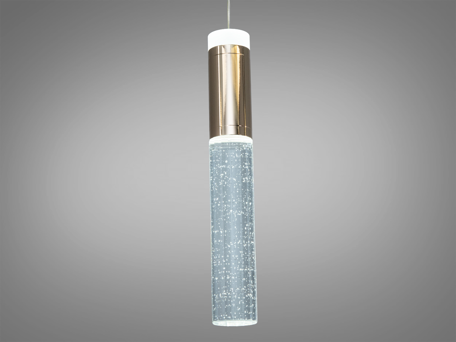 Підвісний світильник циліндричної форми з прозорим акрилом, що містить бульбашки. Підходить для сучасного інтер′єру.