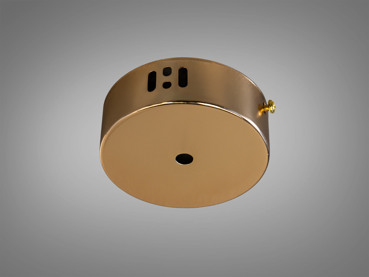 Кругла металева основа для стельового світильника золотистого кольору з отворами для монтажу.