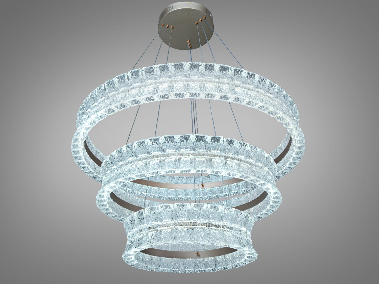 Акрилові три кільця підвісного світильника з LED-освітленням, підвішені на тонких тросах. Прозорі акрилові деталі надають йому елегантності, ідеальний для вітальні.