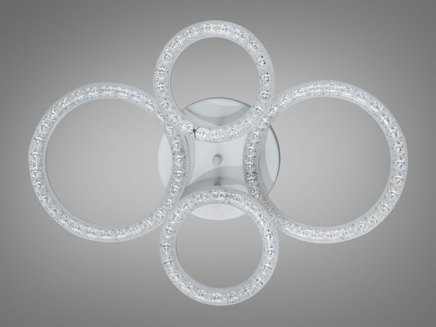 Світильник із чотирма LED-кільцями, вигляд зверху, матовий корпус, підходить для спальні.