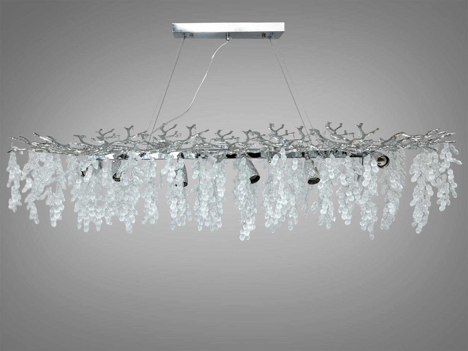 Кришталева підвісна люстра «Гліцинія», хром, 12xE14. Витягнута форма, освітлення до 25 м², алюмінієвий каркас, монтажна планка, регульована висота. Підходить для їдальні та вітальні.