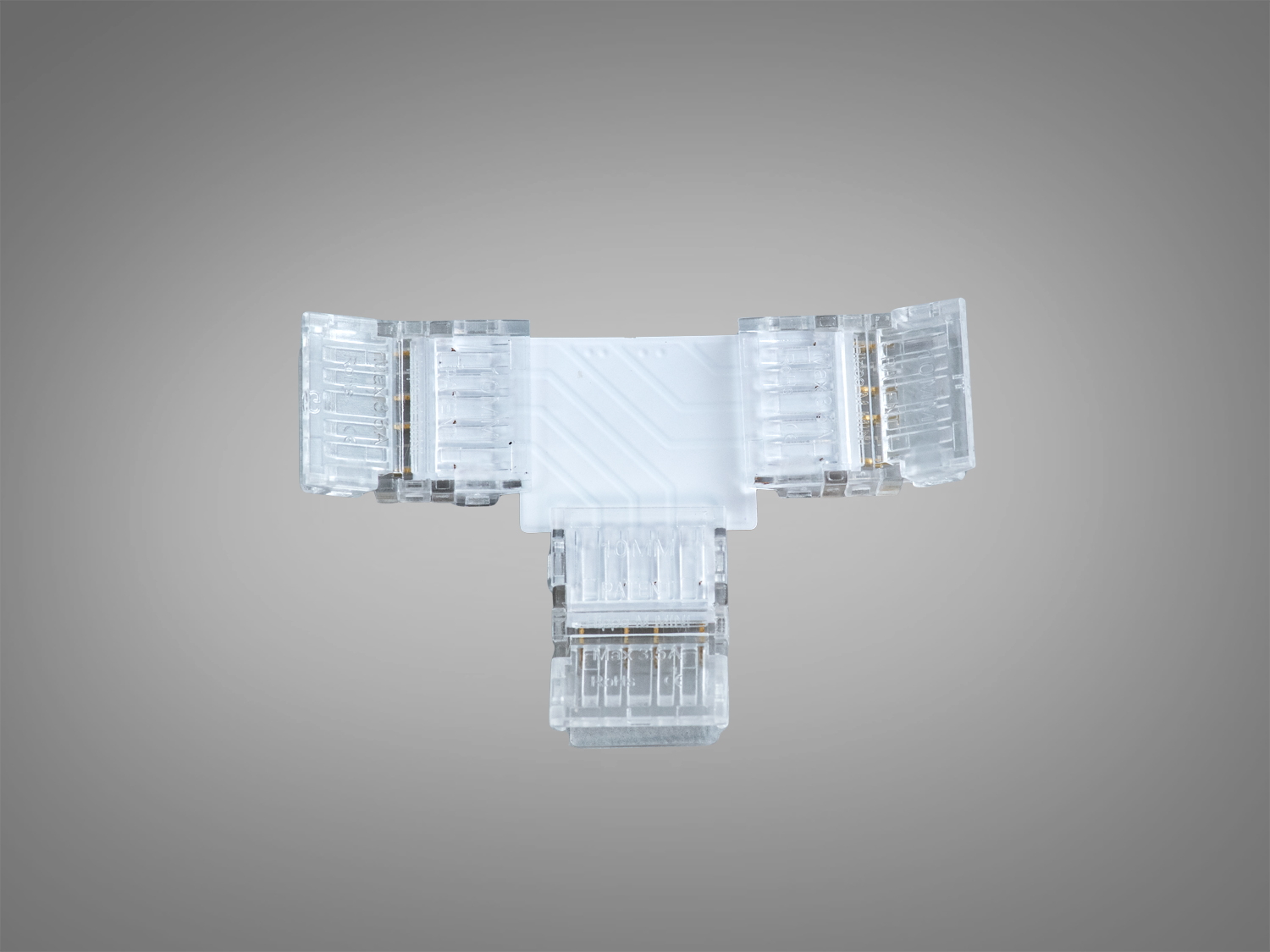 Прозорий Т-подібний конектор для світлодіодних стрічок, виготовлений з пластику. Призначений для з′єднання трьох стрічок для рівномірного освітлення.