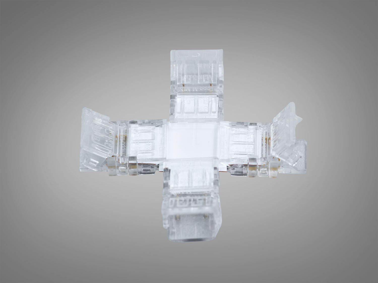 Прозорий хрестоподібний конектор для світлодіодних стрічок, виготовлений з пластику, призначений для внутрішнього монтажу.