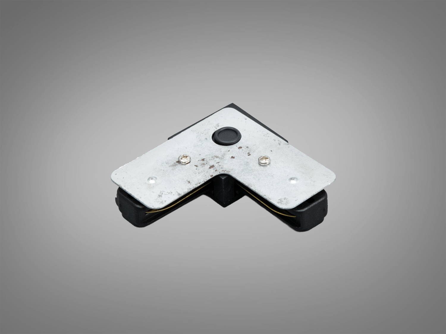 Металевий кутовий з′єднувач для трекового світильника, забезпечує надійне з′єднання та стабільність у системах освітлення під прямим кутом.