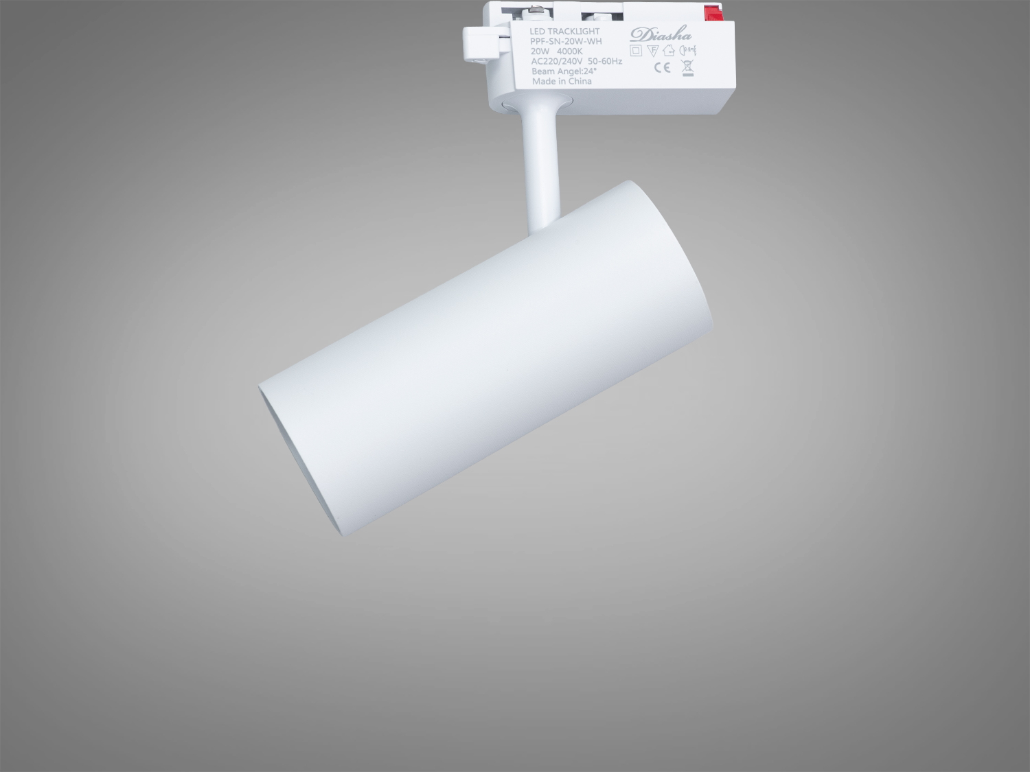 Білий циліндричний трековий світильник з інформаційною наклейкою на корпусі, призначений для монтажу на стельову рейку.