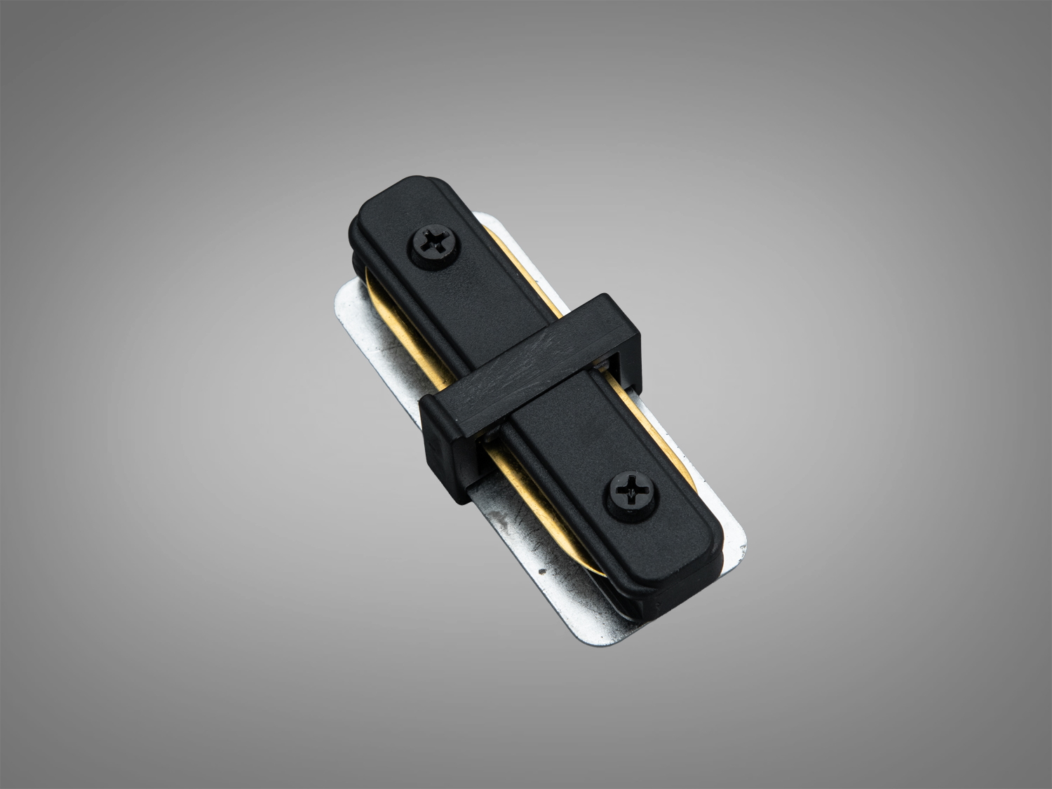 Накладний I-зєднувач серії 1209 у чорному кольорі для трекових систем 220 В. Створює надійне пряме з’єднання двох ділянок шинопроводу в інтер’єрі.