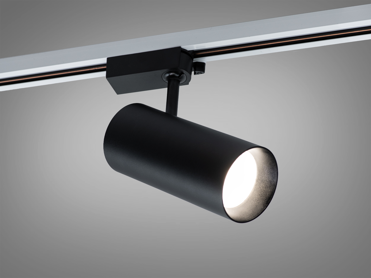 Поворотний чорний трековий LED світильник 30 Вт для систем 220 В з магнітним кріпленням і лінзою. Створює кероване акцентне світло для дому та комерції.