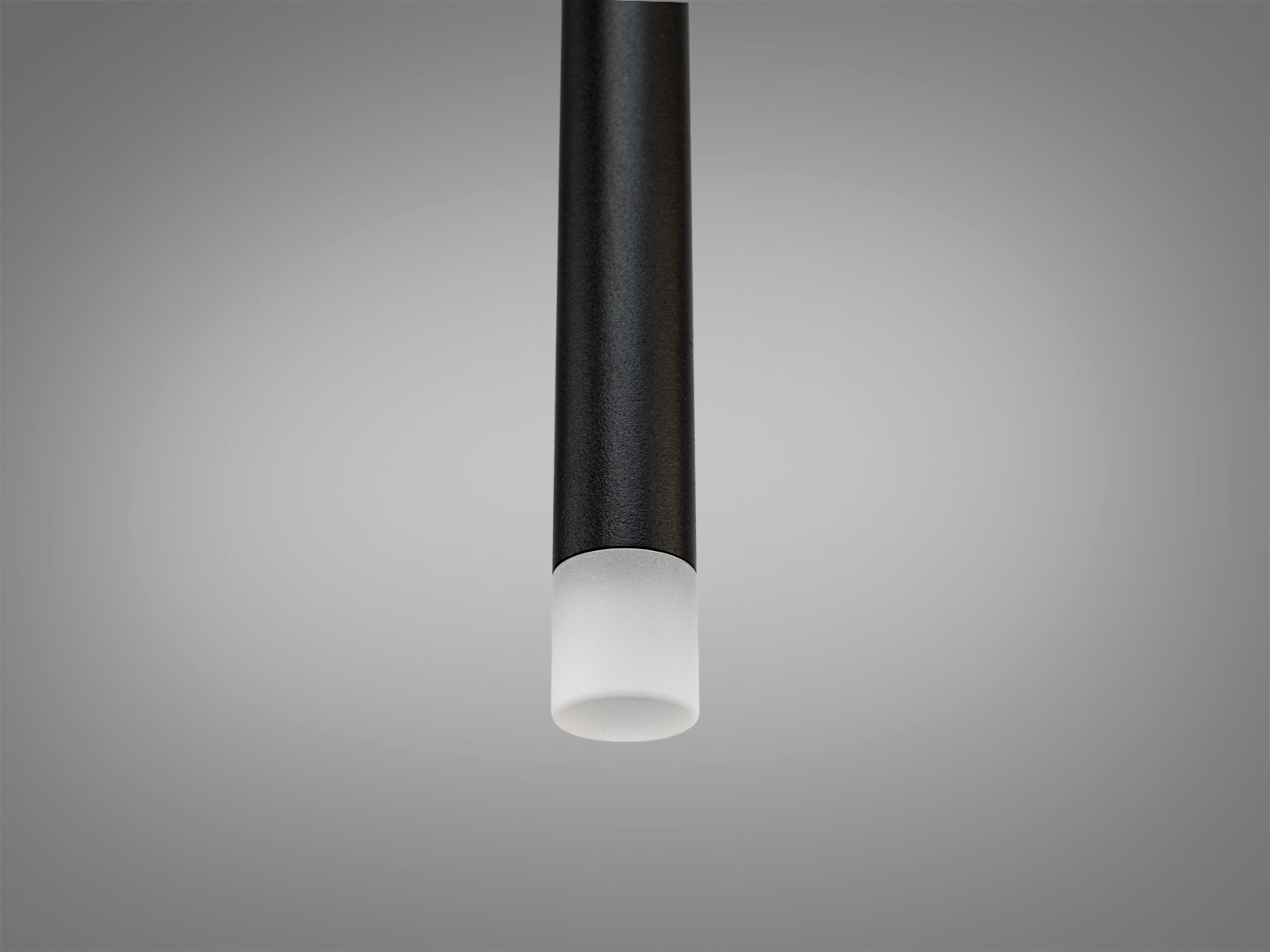 Деталь підвісного світильника, чорний циліндр з матовим покриттям, акцент на розсіювачі світла для м′якого освітлення.
