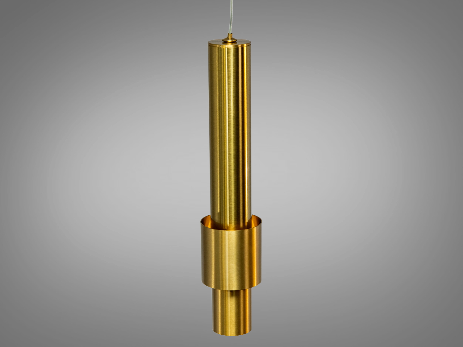 Латунний підвісний світильник з гладкою поверхнею, циліндрична форма, підходить для стильних приміщень, створює фокусне освітлення.