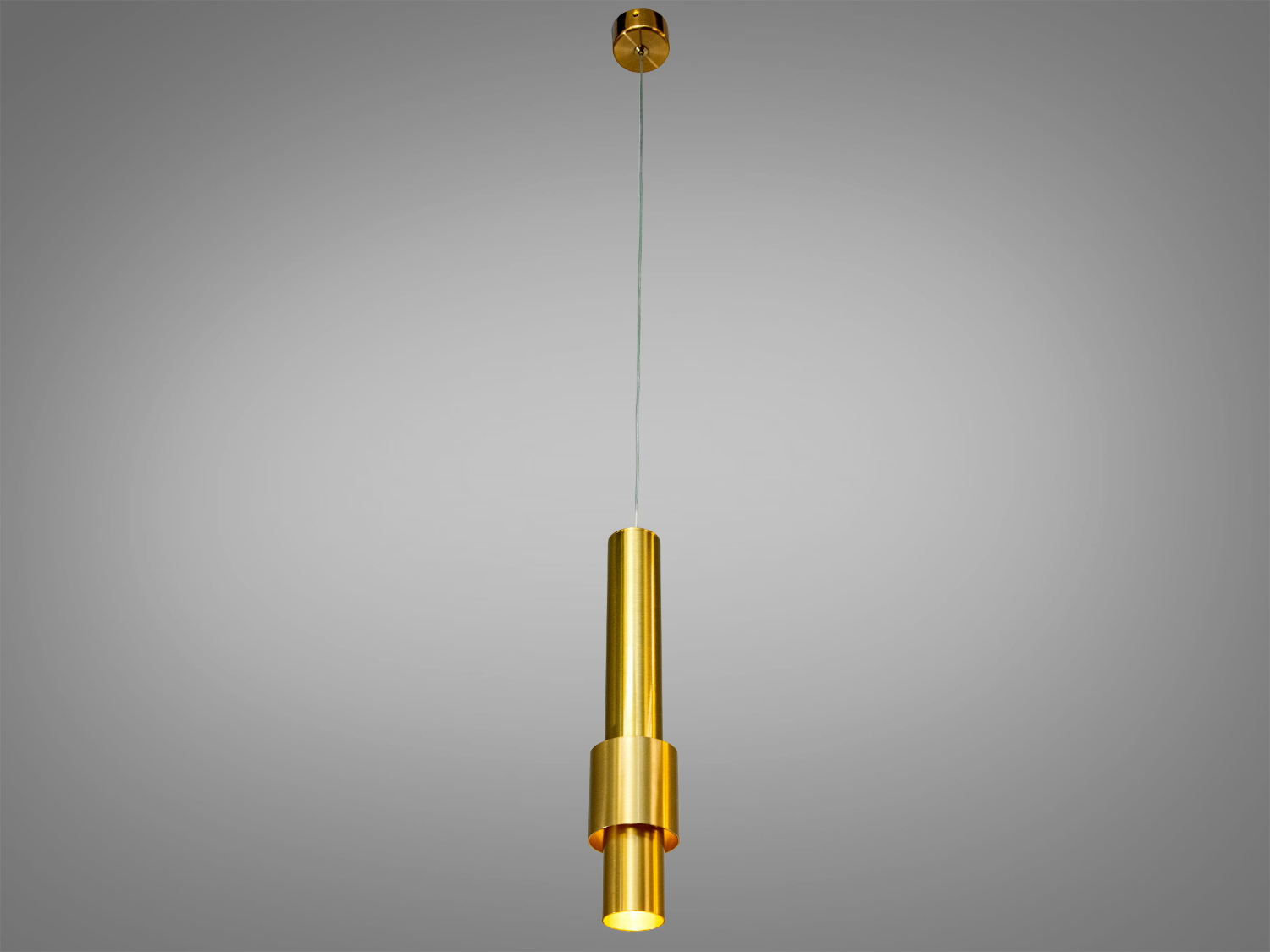 Підвісний світильник з латуні, циліндричний дизайн, встановлений на довгому тросі, ідеальний для високих стель.