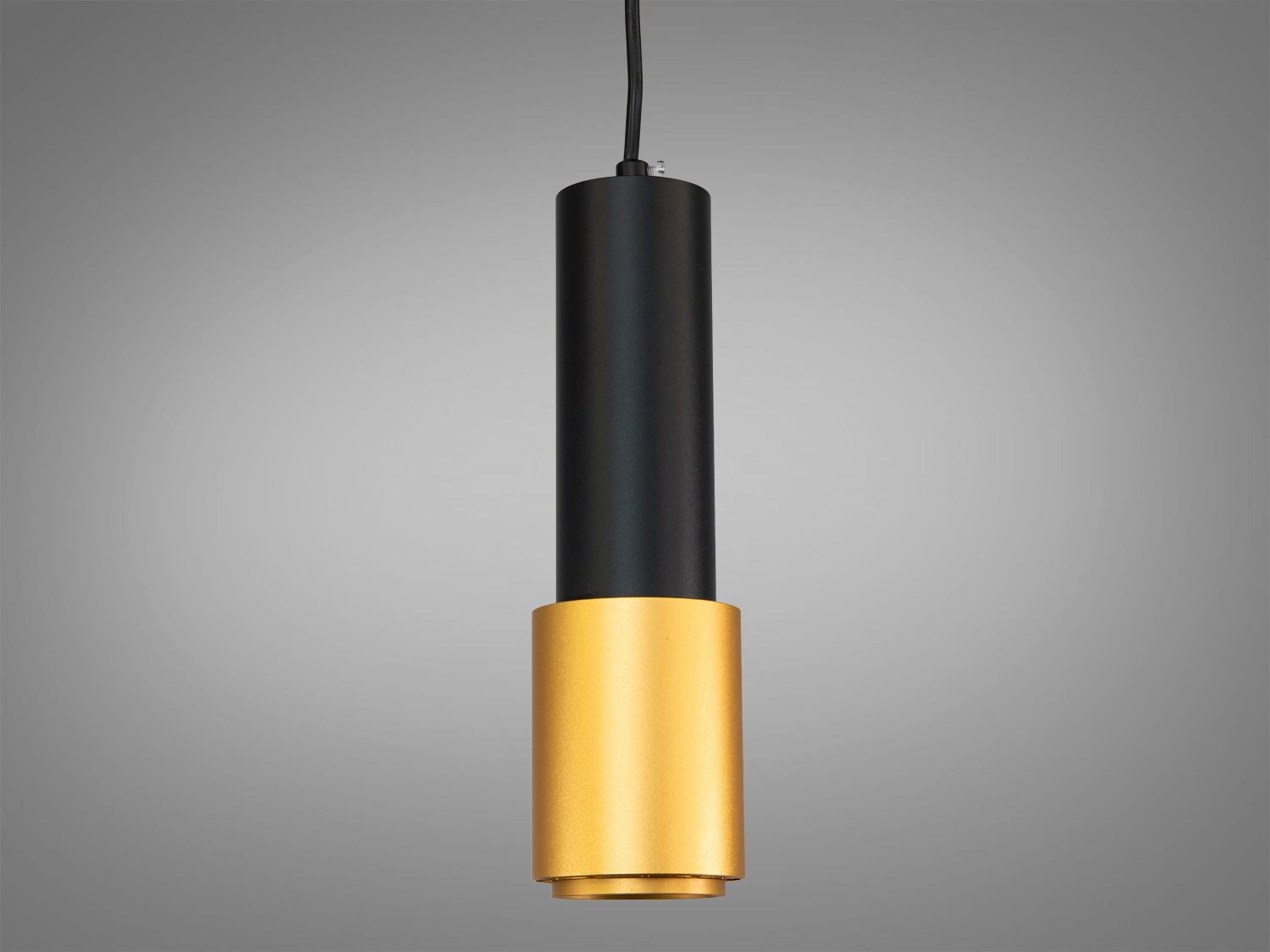 Підвісний світильник циліндричної форми з чорним корпусом і золотистою основою, підходить для сучасного інтер′єру.