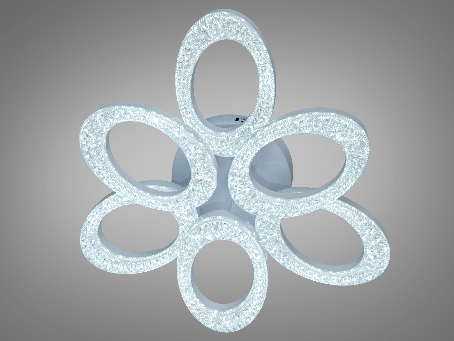 Світильник з шістьма овальними LED кільцями, що випромінюють холодне світло. Підходить для монтажу на стелю.