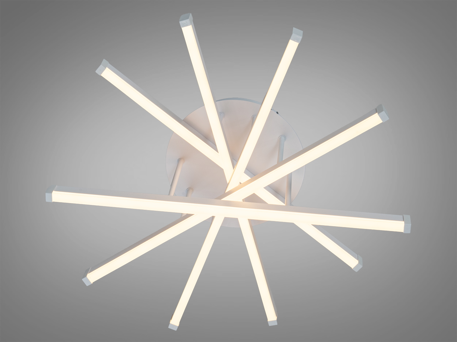 Стельовий світильник з теплим білим світлом, що випромінюється з LED-смуг, розташованих у формі зірки. Ідеальний для затишних просторів.