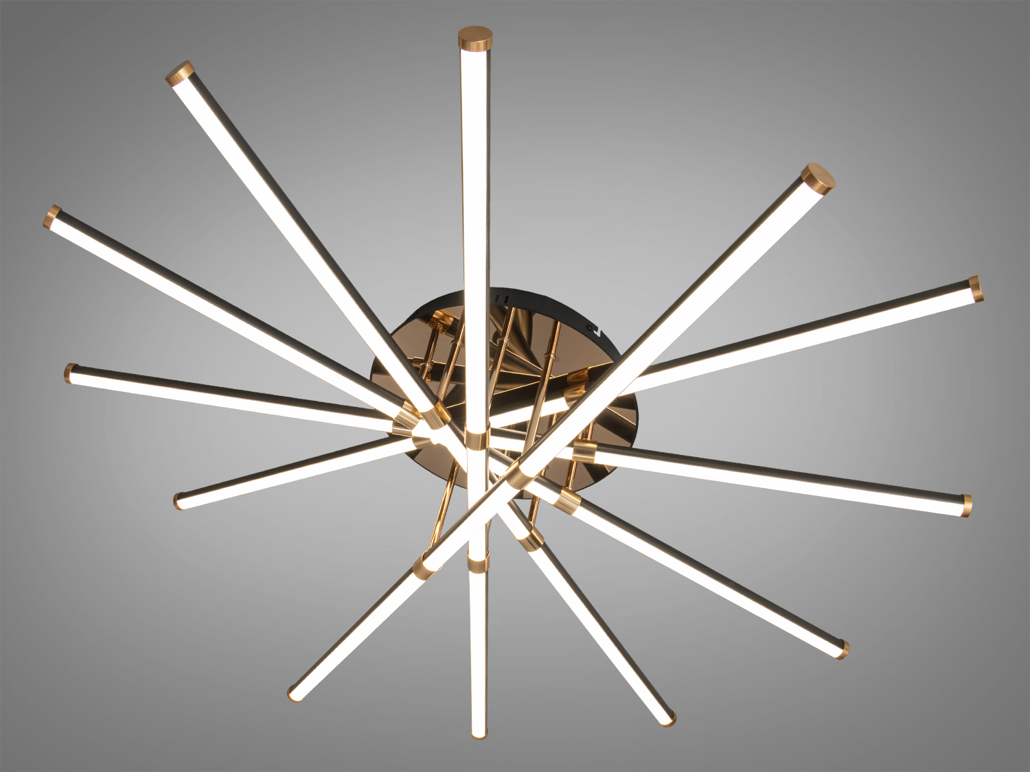 Світильник у формі зірки з металевими трубками, що виходять з центральної основи, підходить для сучасних інтер′єрів.
