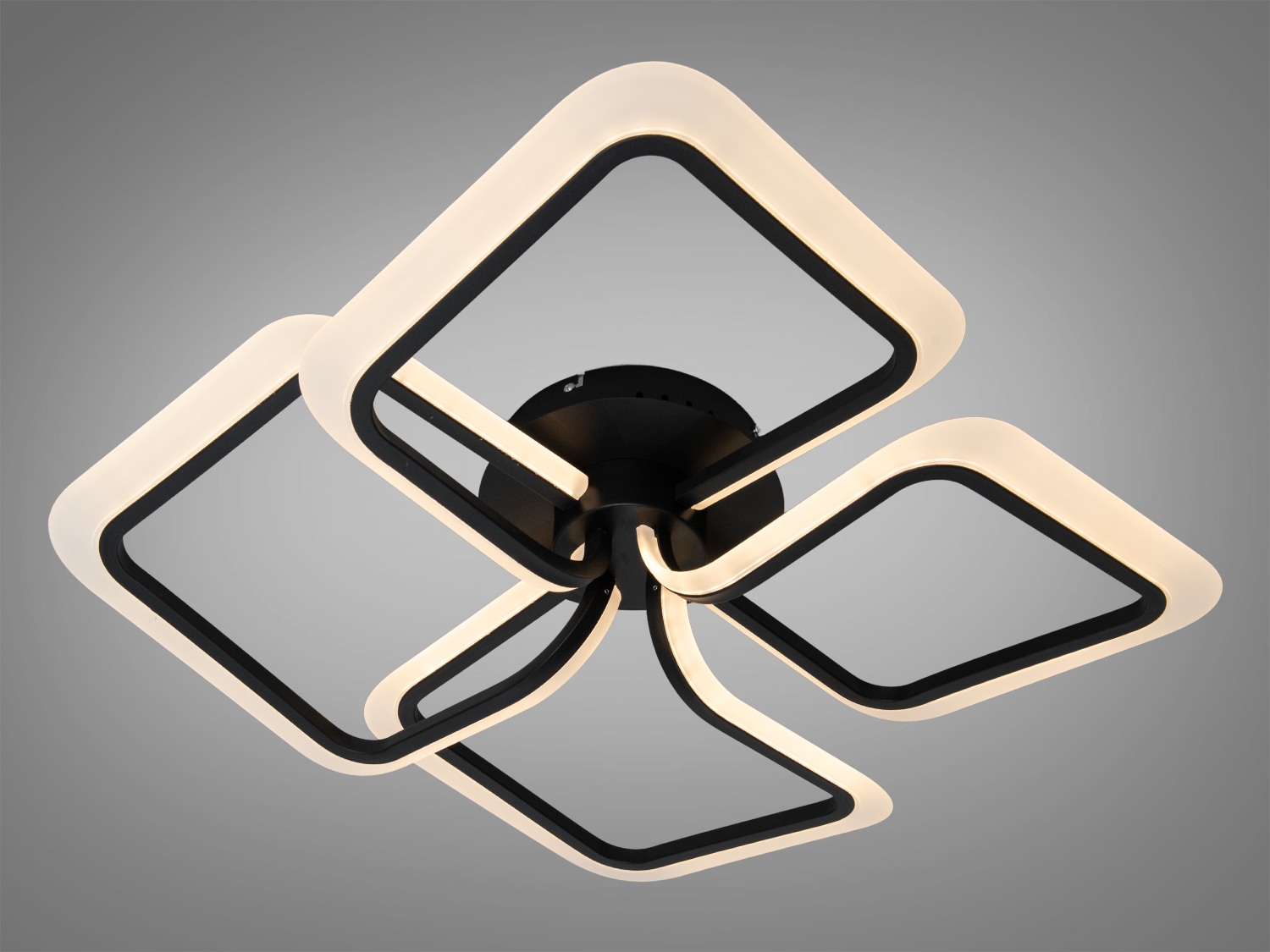 Світильник з теплим LED-світлом, чорна основа. Геометричний дизайн, підходить для вітальні.