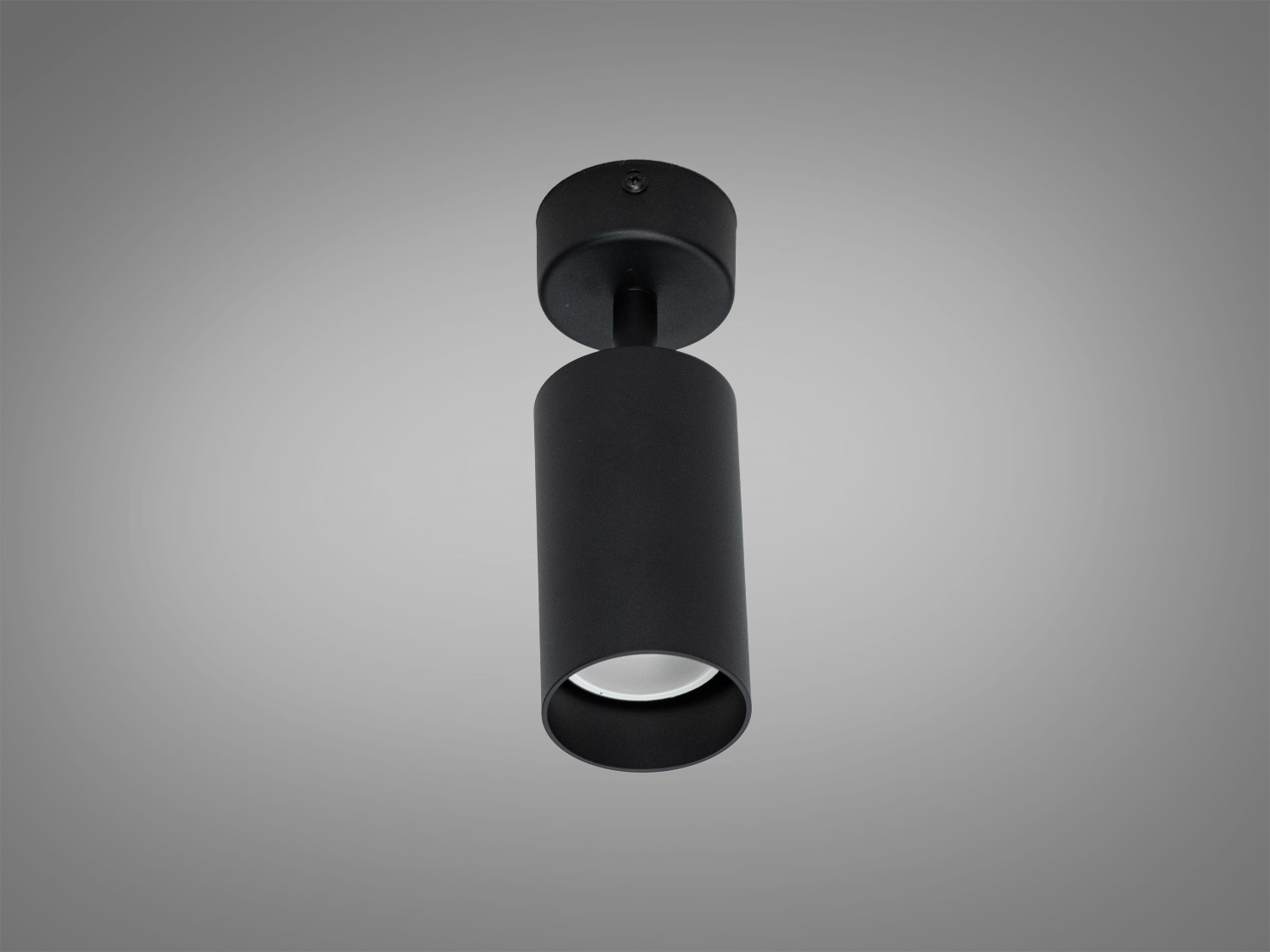 Світильник циліндричної форми з чорним покриттям, призначений для монтажу на стелю. Ідеальний для акцентного освітлення в сучасних просторах.